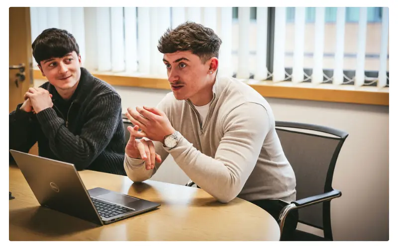 Two people in a meeting