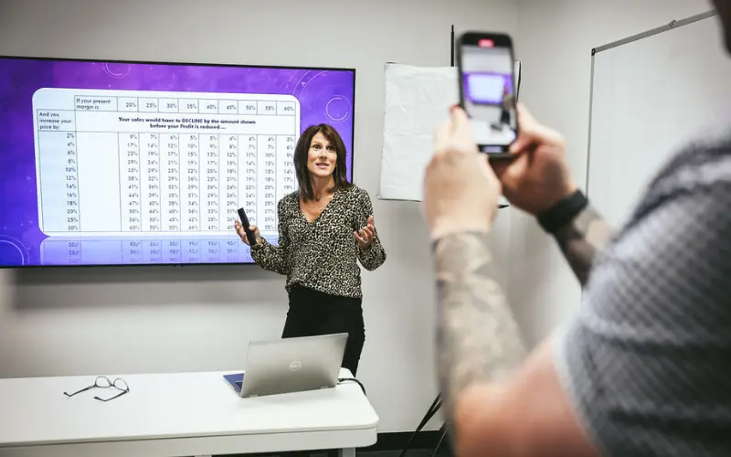 Sarah filming a video guide on a mobile phone